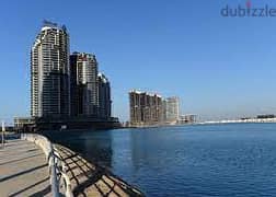Months received!! Apartment for sale, first row on the sea, fully finished, with hotel services, in Al Alamein Towers, North Coast