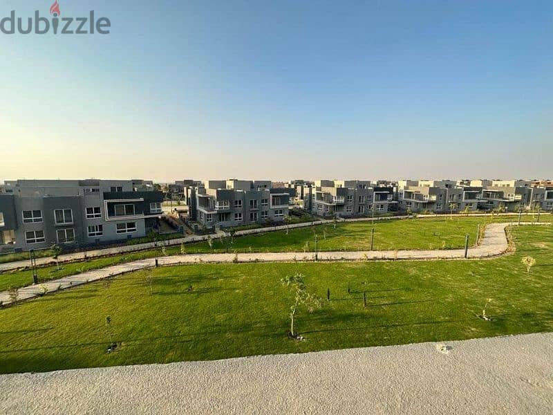 Distinctive 135 meter apartment for sale, fully finished, distinctive view, private garden, in Sheikh Zayed, next to Mountain View and October Plaza 10