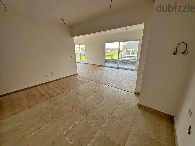 Distinctive 135 meter apartment for sale, fully finished, distinctive view, private garden, in Sheikh Zayed, next to Mountain View and October Plaza 11
