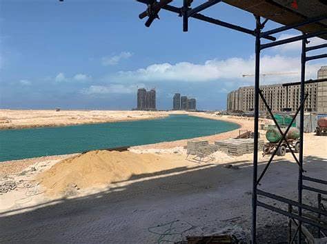 For sale in the Latin Marine District, a finished apartment, receiving prime location, on Lake Alamein and the towers directly, in installments 1