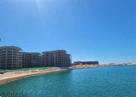 For sale in the Latin Marine District, a finished apartment, receiving prime location, on Lake Alamein and the towers directly, in installments 2