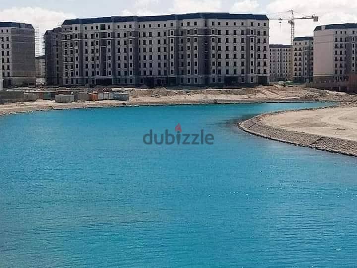 For sale in the Latin Marine District, a finished apartment, receiving prime location, on Lake Alamein and the towers directly, in installments 4