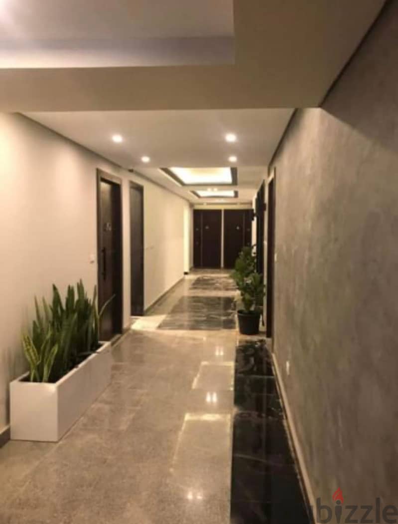 OWN A GROUND FLOOR APARTMENT WITH A PRIVATE GARDEN, READY FOR HOUSING, WITH A 10% DOWN PAYMENT AND INSTALLMENTS FOR 6 YEARS IN SUN CAPITEL COMPOUND 3