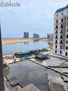 View on the lagoon in El Alamein, 120 sqm apartment, nautical road, finished, ready for receipt, with a 15% down payment and payment facilities
