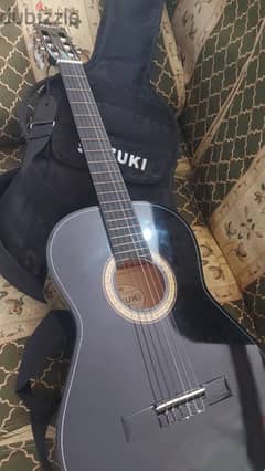 جيتار سوزوكي مع شنطة Suzuki guitar with bag