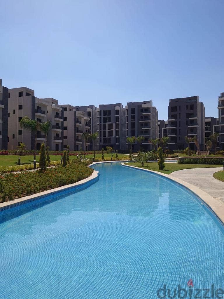 Receive immediately with the lowest down payment. . 144 sqm apartment with garden for sale in installments in 6th of October in Sun Capital October 2
