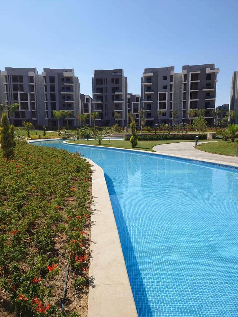 Receive immediately with the lowest down payment. . 156 sqm apartment with garden for sale in installments in 6th of October in Sun Capital October 9