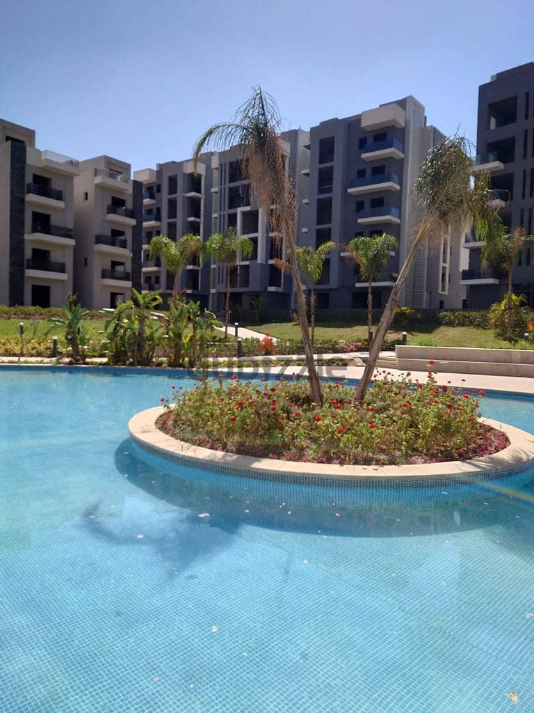 Receive immediately with the lowest down payment. . 156 sqm apartment with garden for sale in installments in 6th of October in Sun Capital October 11