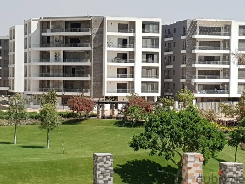 Apartment with 130 square meters and a 45 square meter garden for sale, located in front of Cairo International Airport, available for installment. 1