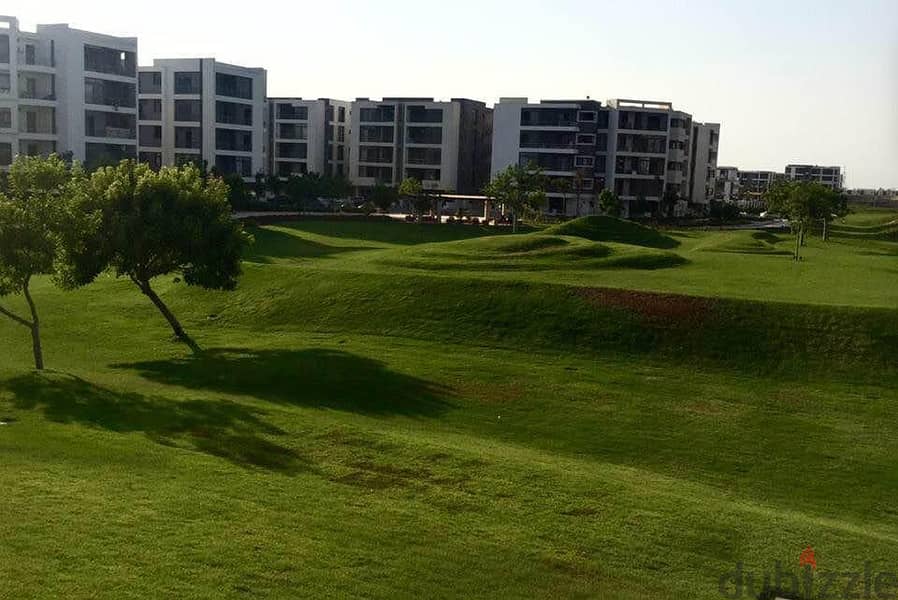 Apartment with 130 square meters and a 45 square meter garden for sale, located in front of Cairo International Airport, available for installment. 10