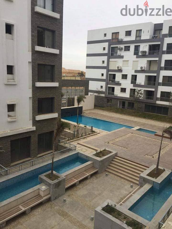 A snapshot apartment for sale at the old price in the most prestigious compounds in Egypt in front of the airport + in installments 10