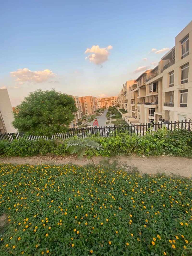 Very special location in front of Cairo Airport, 9 minutes to the community, 137 sqm apartment on direct view + 100 sqm garden for sale in Taj City Co 7