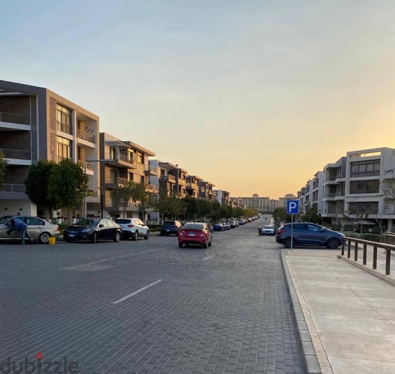 Very special location in front of Cairo Airport, 9 minutes to the community, 137 sqm apartment on direct view + 100 sqm garden for sale in Taj City Co 10
