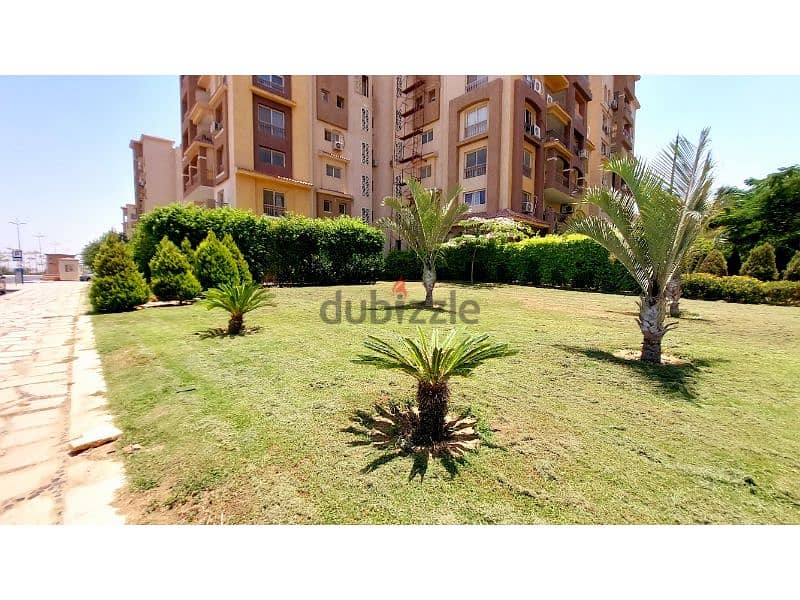 Ground floor apartment with a private garden for sale in the best location in Madinaty, B3. 1
