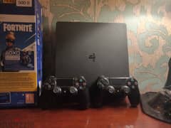 PS4 slim with 2 original controllers + 4 games