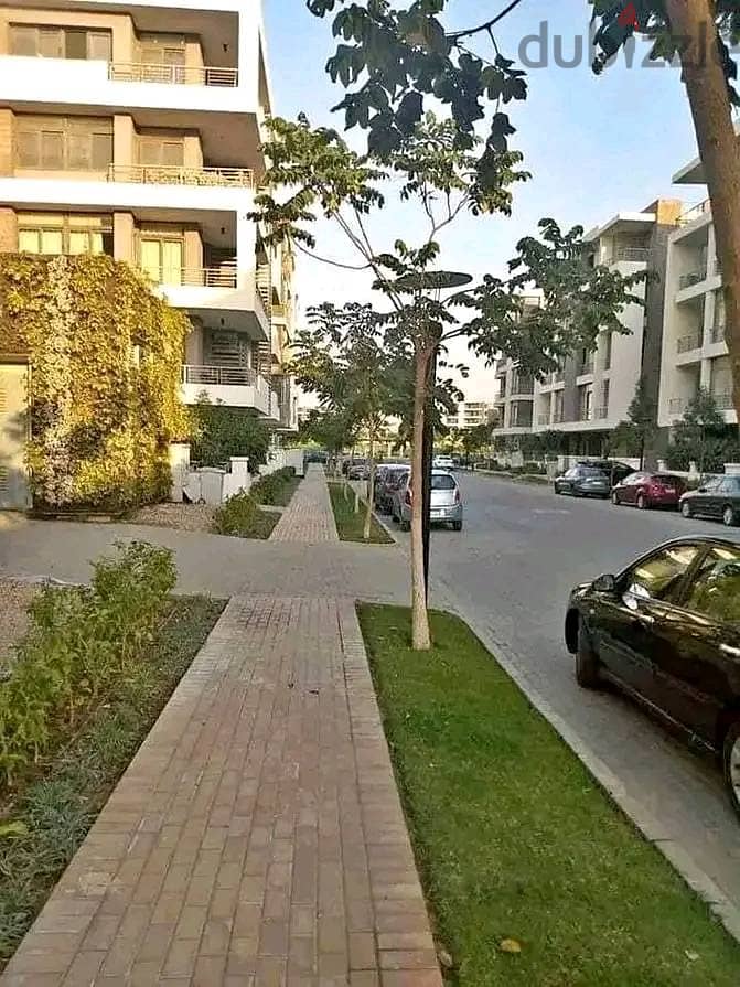 Garden apartment for sale at a very special price Near Heliopolis and Nasr City Taj City Compound 5