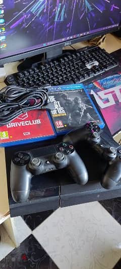 playstation 4 with 2 controllers and 2 games