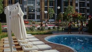 Two-bedroom apartment with lake view, steps from the American University, the most luxurious compound in the settlement, wall in wall, with Diyar Al M