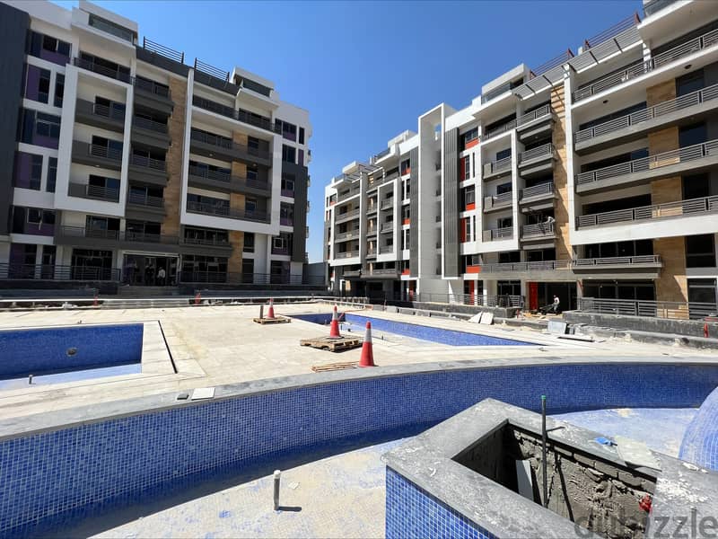 Apartment in The Icon Compound the price includes garage and club in the new cairo 7