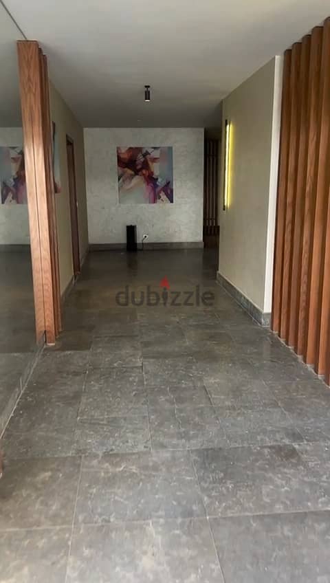 Ground floor apartment with garden for sale in installments in Mountain View iCity October Compound 7