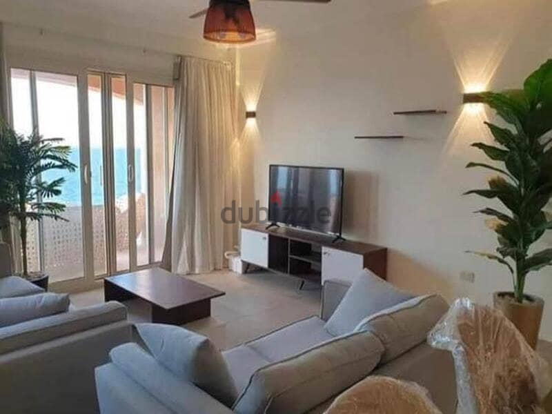 Sky chalet for sale, “3 rooms + maid’s room,” view lagoon in Telal Ain Sokhna village, next to Porto, fully finished, in installments 45