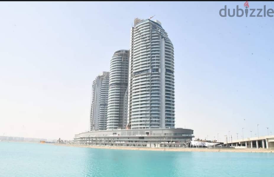 Hotel apartment for sale, finished for months, with air conditioners, first row on the sea, in Al Alamein Towers, City Edge 1