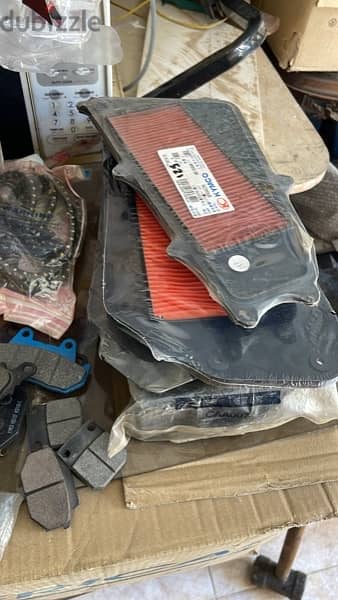 new kymco brake pads , air filters , oil filters ,safety knees 3