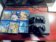 playstation 4 slim with 2 controls and 6 games 500GB