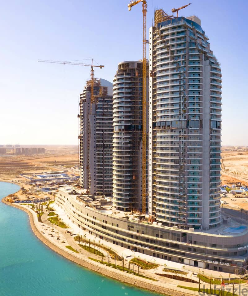 Ready apartment for sale with air conditioners and kitchen, delivery soon in the new Alamein Towers 1