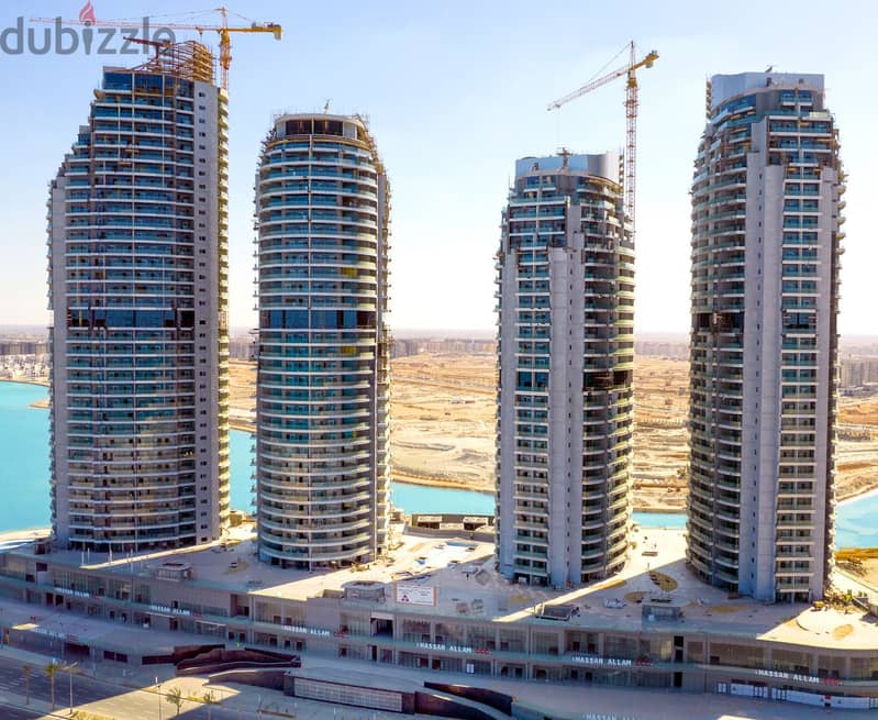 Ready apartment for sale with air conditioners and kitchen, delivery soon in the new Alamein Towers 2