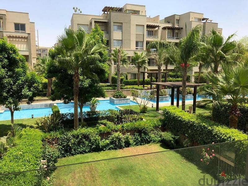 Ground floor apartment with garden, finished, for sale in Swan Lake Hassan Allam Compound, in front of Al-Rehab 2
