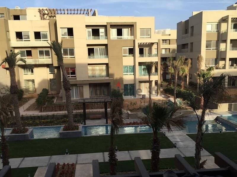 Ground floor apartment with garden, finished, for sale in Swan Lake Hassan Allam Compound, in front of Al-Rehab 6