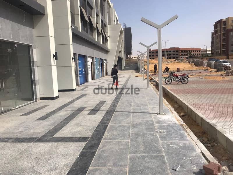 Restaurant for sale in Shorouk, 59 sqm with 55 sqm terrace, immediate delivery, double face, ground floor, two main facades, Dar Misr, the central one 7