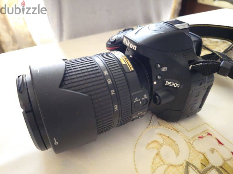 nikon d5200 with 18/140 lens used like new 6