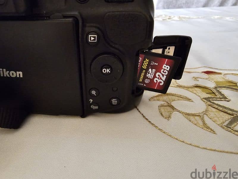 nikon d5200 with 18/140 lens used like new 10
