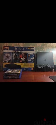 playstation 4 slim with 2 original controllers+4games