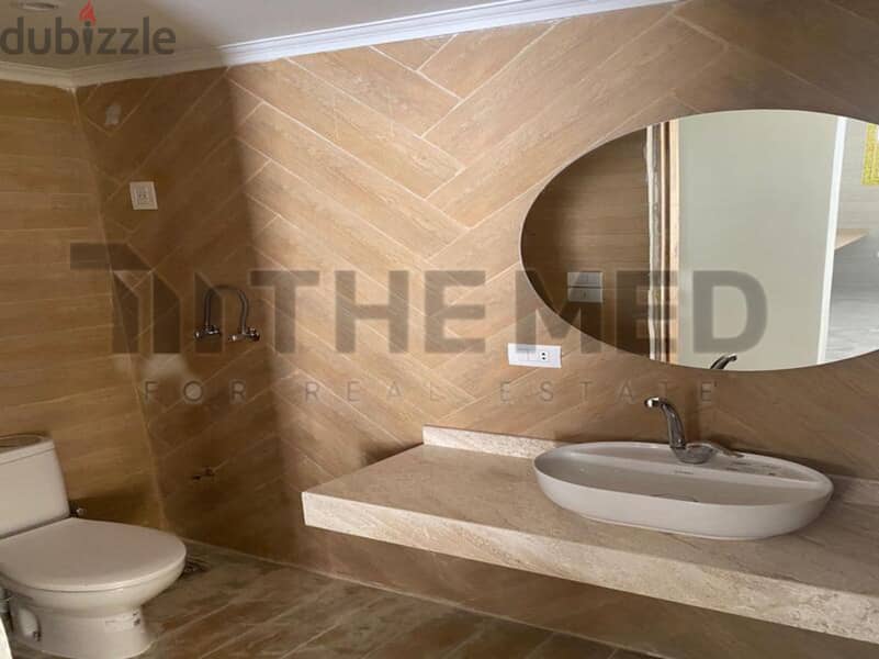 Apartment for sale, ground floor, with garden, prime location, in the Ninth District, Sheikh Zayed 10