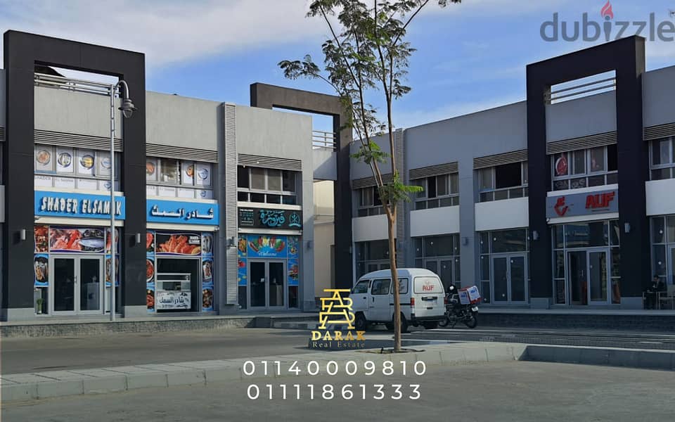 Shop for sale, 76 sqm, rented, first blocks in the Craft Zone, Madinaty, at the entrance to the market and the entrance to East Hub 6