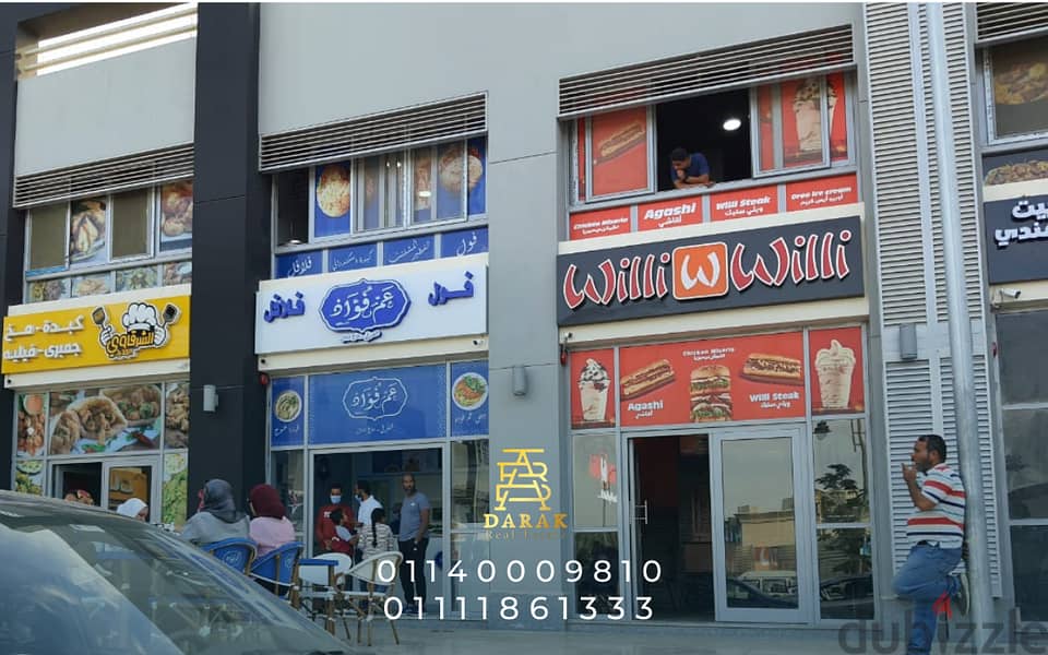 Shop for sale, 76 sqm, rented, first blocks in the Craft Zone, Madinaty, at the entrance to the market and the entrance to East Hub 14