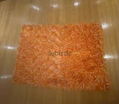 ‏سجادة برتقالي في أبيض 135  في 200 سانتي/ orange and white carpet