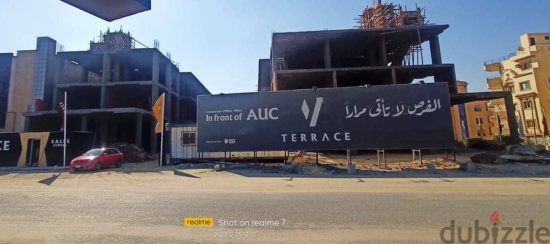 Commercial store for sale, 191 square meters, in the Fifth Settlement, in front of the American University and  حل تجاري للبيع 191 م في التجمع الخامس 6