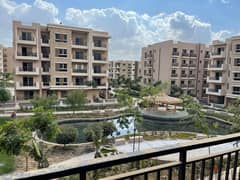 For sale, a two-bedroom apartment with a double view on the landscape in Taj City New Cairo, in installments over the longest payment period without i