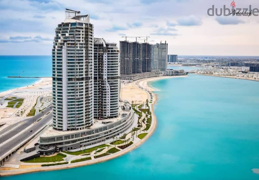 An apartment in the towers with hotel finishing ((marble)) to be received within months with a full view of the lagoon and the city of El Alamein 1