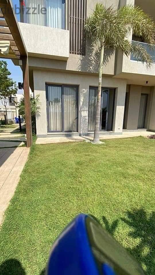 For sale apartment 164 m with garden and private entrance in New Origami on Suez Road in front of Cairo Airport in Taj City 2