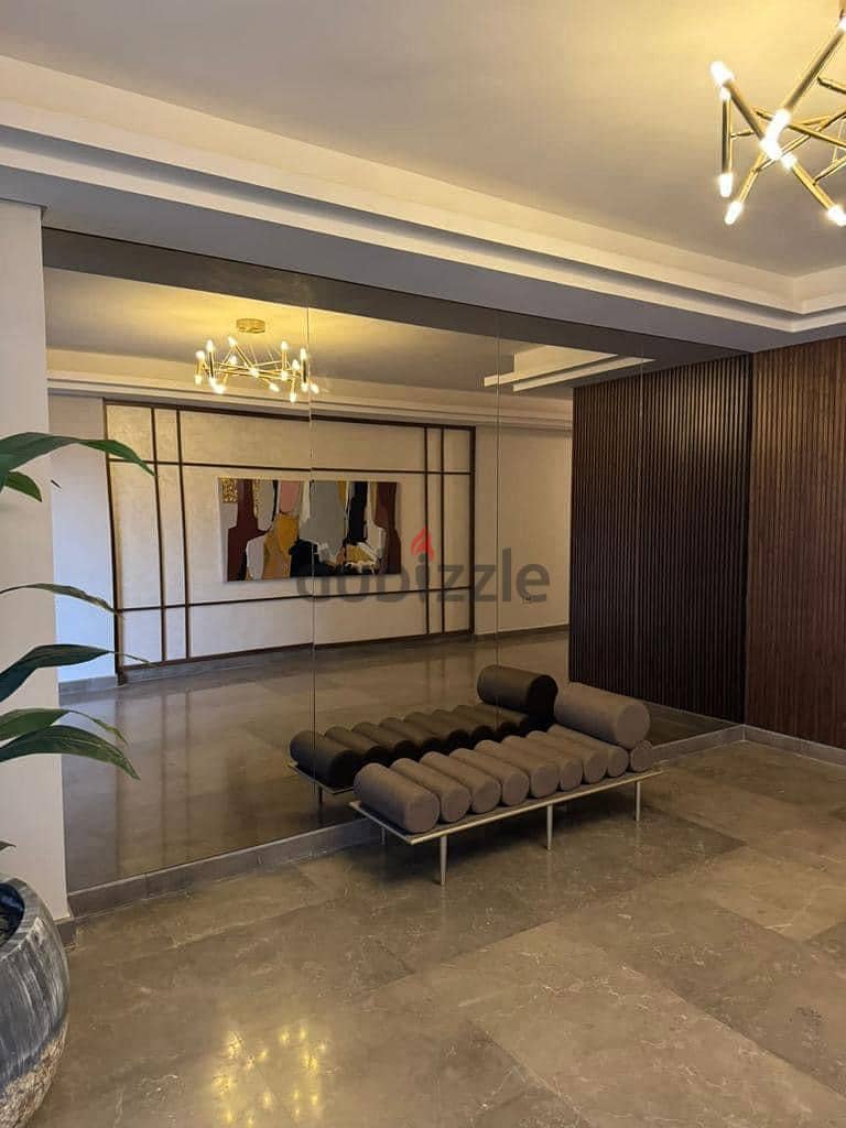 For sale, an apartment for sale, fully finished, in Zed East Towers, New Cairo, the latest project of Ora Company by Naguib Sawiris, with the largest 2