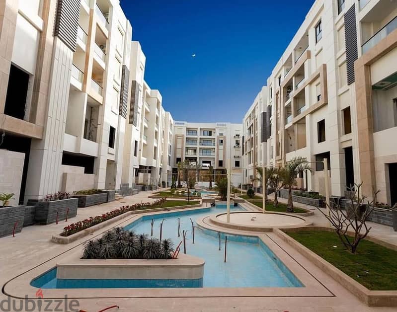 Immediately receive a fully finished hotel apartment with kitchen, managed by Concode International, in front of City Center Almaza, with a 10% down p 0