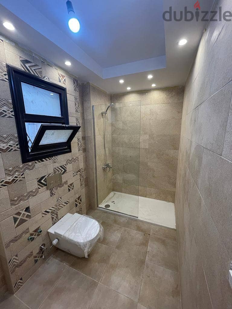 Immediately receive a fully finished hotel apartment with kitchen, managed by Concode International, in front of City Center Almaza, with a 10% down p 6