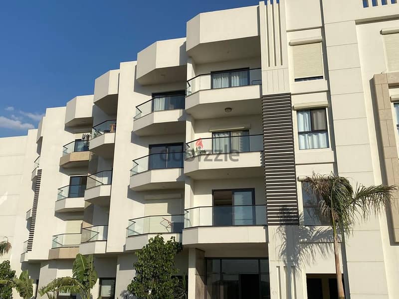 Immediately receive a fully finished hotel apartment with kitchen, managed by Concord, in front of City Center Almaza, with the lowest down payment an 1