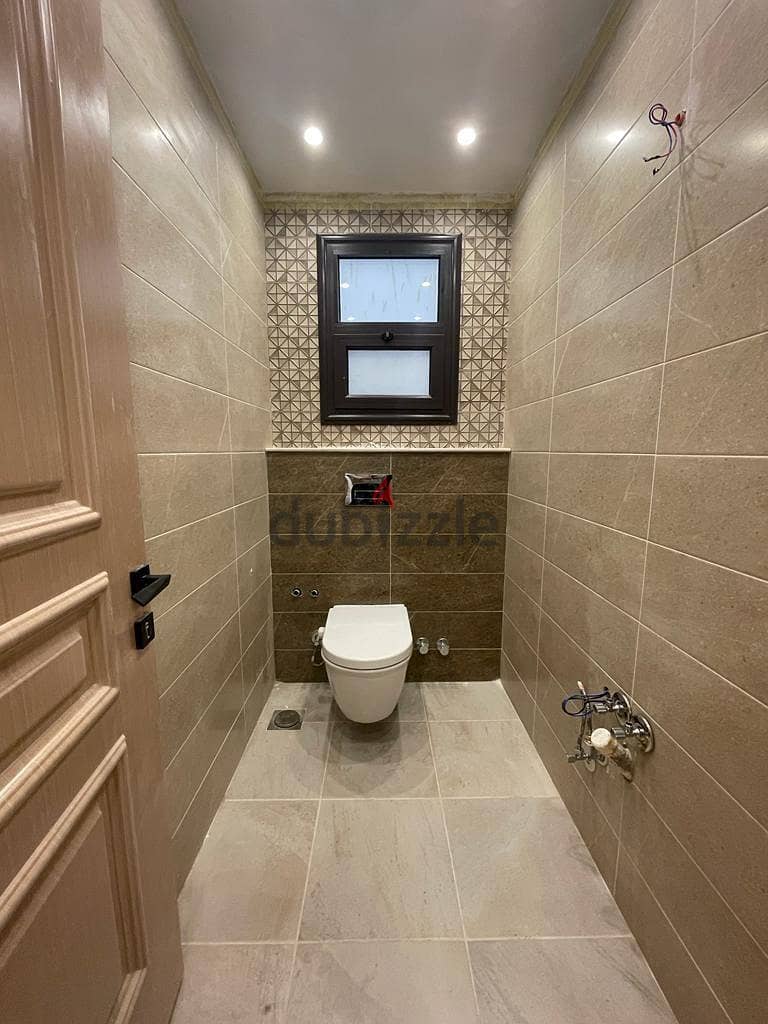Immediately receive a fully finished hotel apartment with kitchen, managed by Concord, in front of City Center Almaza, with the lowest down payment an 12