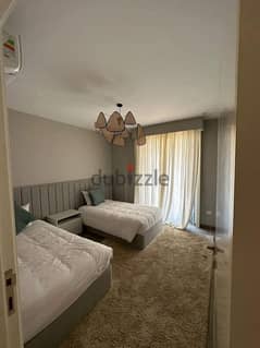 Apartment + garden for sale in installments, finished with air conditioners, in a distinctive location in the heart of Sheikh Zayed, next to Hyper One